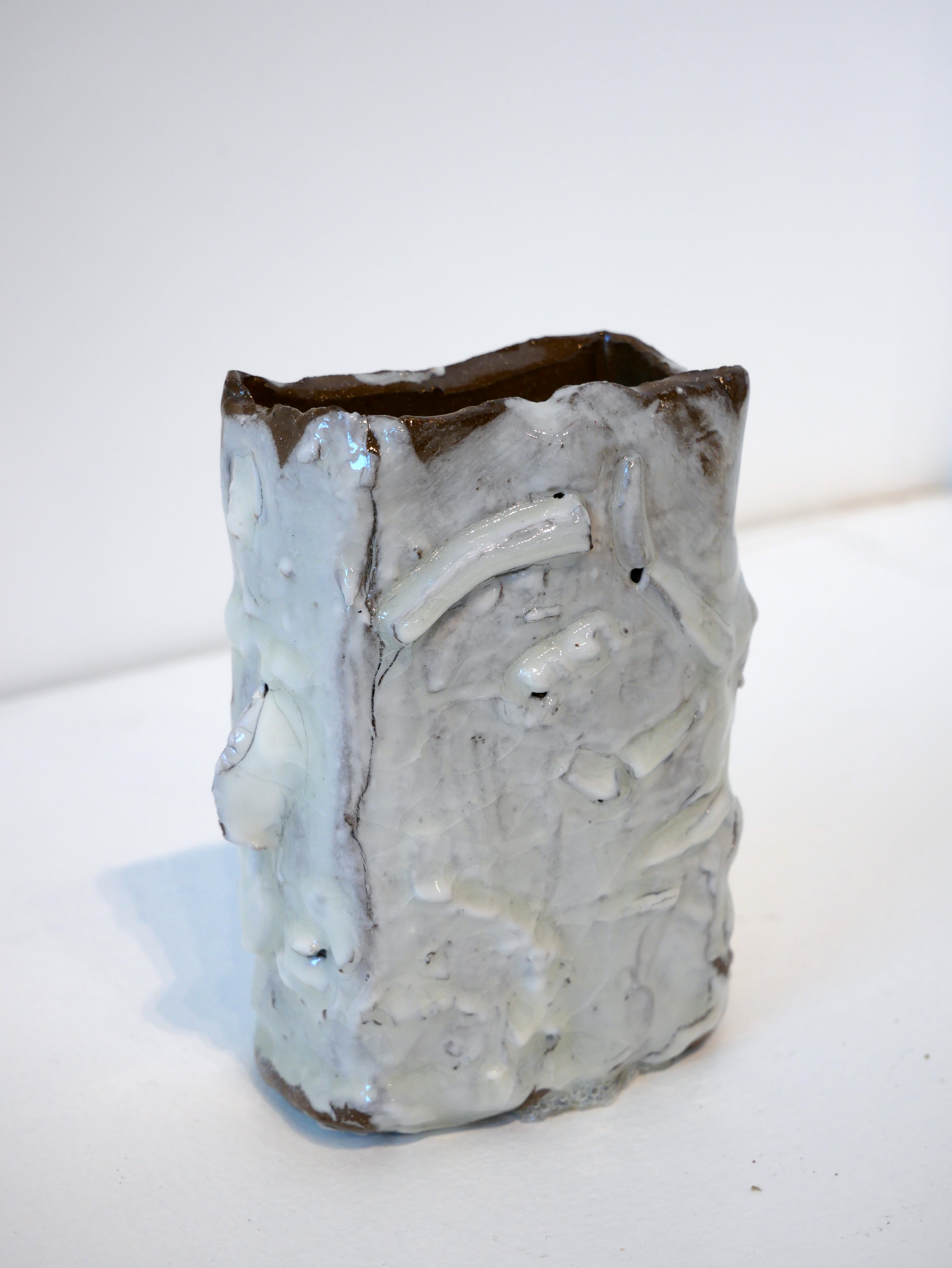 Brown pot with White Slip